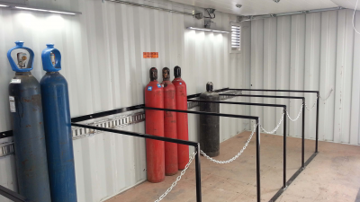 Inside of container holding multiple pressurized cylinders
