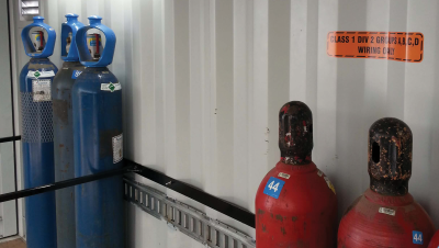 Close up of pressurized cylinders inside of container