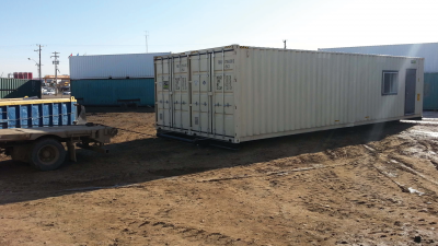 Trailer cable attached to container and pulling the container onto trailer