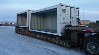 Two container with bay doors open sitting on trailer