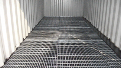 Close up photo of metal graded floor of container