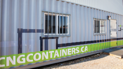Angle photo of exterior of an office container highlighting the cng website