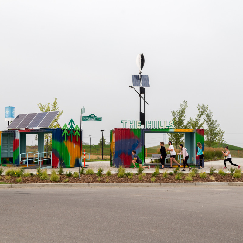 Colourful containers with people doing workouts around it
