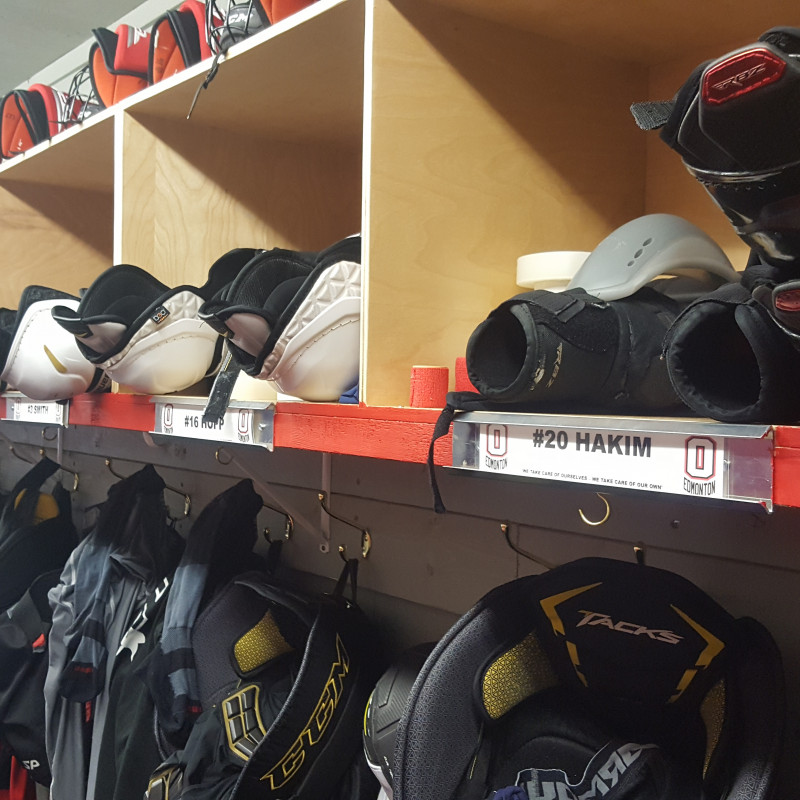 Hockey equipment hung up and inside cubbies