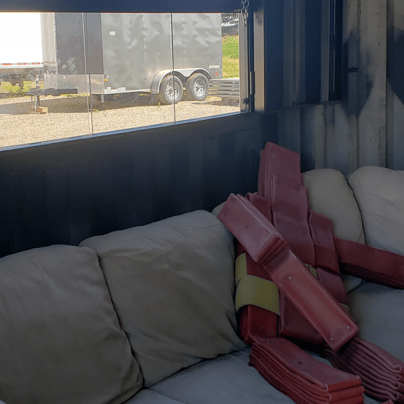 Inside of container with a rescue dummy on couch