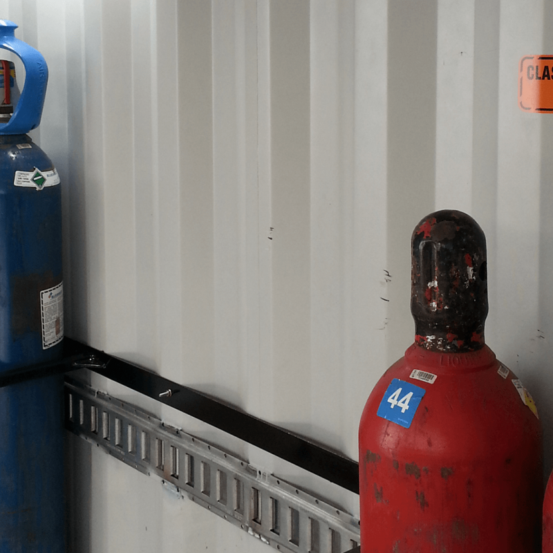 Close up of gas cylinders inside of container