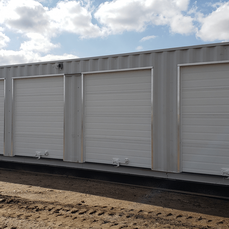 Large container with 5 garage style doors