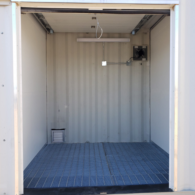 Close up of room in container with graded floor